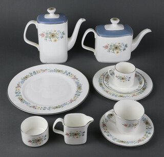 A Royal Doulton Pastoral tea, coffee and dinner service comprising 6 coffee cups, 6 saucers boxed, 12 tea cups (1 a/f), 12 saucers, 19 coffee cans (3 a/f), 15 saucers, 2 coffee pots, 1 tea pot, 2 lidded sugars, 2 milk jugs, 3 cream jugs, 2 bowls, 24 side plates, 15 soup bowls, 2 sauce boats on stands, 15 medium plates, 30 dinner plates (1 a second), 3 oval meat plates, 2 sandwich plates, 2 tureens and covers, 4 vegetable dishes and 2 non matching tureens and covers 