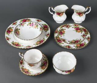 A Royal Albert Old Country Roses part tea and dinner service comprising 12 tea cups, 12 saucers, 12 small plates, 12 side plates (6 are seconds), 2 cake plates, 11 soup bowls, 2 milk jugs, 2 sugar bowls, 3 dishes, 14 dinner plates 