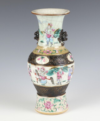 A Chinese crackle glazed oviform vase decorated with a band of figures with lion mask handles 24.5 cm