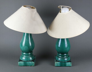 A pair of Chinese turquoise oviform table lamps on square bases 37cm 