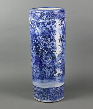 An early 20th Century Japanese transfer print blue and white cylindrical stick stand decorated with birds amongst flowers 61cm 