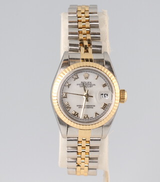 A lady's Rolex Oyster Perpetual datejust wristwatch in a bi-metallic case with bi-metallic bracelet, contained in a 25mm case, the bracelet numbered 62523 D/18 with spare link, complete with original guarantee T640349 with 1997/98 plastic calendar, 3 booklets, original box, leather wallet and outer box  