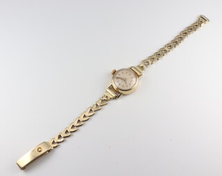 A lady's yellow metal 585 wristwatch, the dial inscribed Junghans, gross weight including movement and glass 13.6 grams 