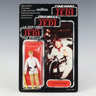Star Wars by Palitoy, a very rare Luke Skywalker farm boy ( brown hair ) with Bespin light saber action figure on tri logo 70 back Return of the Jedi punched card ROTJ 70B ( China 1983  )