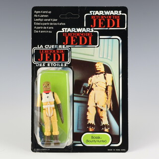 Star Wars by Palitoy, a Bossk ( Bounty Hunter ) action figure on tri logo 70 back Return of the Jedi unpunched card ROTJ 70B ( Hong Kong 1984  )