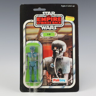 Star Wars by Palitoy, a 2-1B action figure on  41 back Empire Strikes Back punched  card ESB 41B ( Hong Kong 1980  )