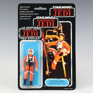 Star Wars by Palitoy, a Luke Skywalker ( X-Wing Fighter Pilot ) action figure on tri logo 70 back Return of the Jedi punched  card ROTJ 70C ( China 1983  )