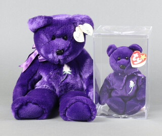 A 1998 Ty Beanie Bear to commemorate Diana Princess of Wales in purple with white rose 14", together with a smaller 1997 ditto in perspex box 