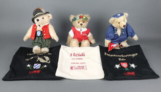 Steiff, limited edition teddy bear Heidi 2002 no.1284 of 1500, ditto Fahnenschwinger bear no.430 of 1500, both complete with cloth bags and certificates and a 2004 Oktoberfest bear complete with bag but no certificate 