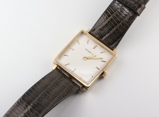 A gentleman's square cased wristwatch the dial inscribed Tiffany & Co, the case numbered 455594, the outer case marked 14k, contained in a 25mm case on a leather strap 