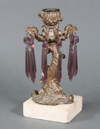 An Empire style gilt candlestick in the form of a dolphin with purple cut lustres, raised on a square marble base 21cm h x 10cm w x 9cm d 