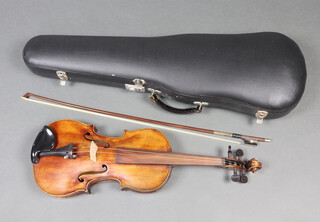 An unlabelled violin with 14cm 2 piece back, the bow marked R.Metzner complete with fibre carrying case 