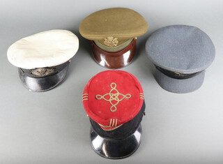 An American World War Two Louisville cap with cap badge (strap f), a French cap (no strap), Royal Naval Officer's cap, a Royal Air Force Officer's cap (all slightly stained)