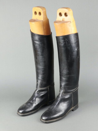 A pair of size 9 Regent black leather riding boots, complete with beech boot trees 