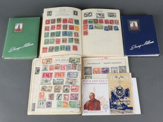 A Nelson album of GB and World used stamps - Canada, India, a Marvel Illustrated stamp album of world stamps - USA, GB, Germany, 2 stock books of Elizabeth II mint and used stamps and a small collection of stamps on paper 