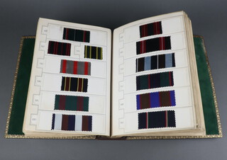 648 19th/20th Century fabric samples contained in a leatherette bound volume 