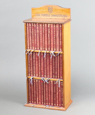 Shakespeare William, "The Temple Shakespeare" 40 volumes London J M Dent, 4th edition 1895, bound in red cloth with gilt spines in fitted mahogany 3 tier bookcase, 49cm h x 21cm w x 11cm d 