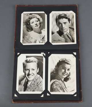 An album of signed, personal, autopen (and printed) and unsigned publicity photos to include Stewart Granger, Gregory Peck, Esther Williams, Ann Todd, James Mason, Jennifer Jones, June Allyson, Bob Walker, Michael Rennie, Anne Crawford, Jean Kent, John Loser, Gene Kelly, Johnny Garfield, Phyllis Calvert, Dennis Price, Lana Turner, Shirley Temple, Robert Newton, Humphrey Bogart, Errol Flynn, John Drake, Dennis Morgan, Robert Young, Lesley Brook, Ann Blyth 