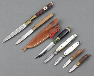 Two miniature pocket knives with 2cm blades, folding pocket knife with 2.5cm blade and mother of pearl grip, twin bladed pocket knife with 3cm blade, mother of pearl grip, pocket knife with 4cm blade and wooden grip, an Eastern folding pocket knife with polished grip marked Corse and an Easter dagger 