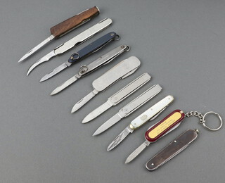 A Redolian Japanese 4 bladed smokers pocket knife with wooden grip, Lewis a twin bladed folding pocket knife with mother of pearl 6cm (grip damaged), Thackery Leeds a twin bladed folding scalpel 9cm, John Watts of Sheffield 2 folding knives - 1 with grip marked Ernest Bennett Saw Makers and 5 other folding knives