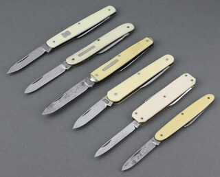 William Rogers a double bladed pocket knife, together with 4 others and a multi bladed pocket knife with nail file, all with simulated ivory grips 