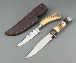 A Bowie knife with 13cm blade and horn grip, 1 other the blade marked Solingen 9cm complete with leather scabbard 