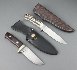 A Howard Hitchmough hunting knife with 12cm blade and stag horn grip with an embossed leather scabbard together with a J Crookes & Sons hunting knife with 10cm blade and leather scabbard 