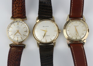 A gentleman's gilt cased Longines wristwatch with seconds at 6 o'clock 30mm, a Hamilton electric ditto 25mm and a Bulova 30mm 