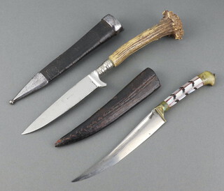 A knife with 10cm blade, stag horn grip and leather scabbard together with a Continental dagger with 12cm blade, horn grip and leather scabbard 