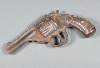 A novelty bronze paperweight in the form of a revolver, the chamber inscribed  "The Scareall"  16cm  