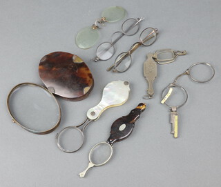 A 19th Century oval magnifying glass in a tortoiseshell frame 9cm, a quizzing glass with mother of pearl mount (f), a pair of lorgnettes in a tortoiseshell case and a collection of spectacles etc