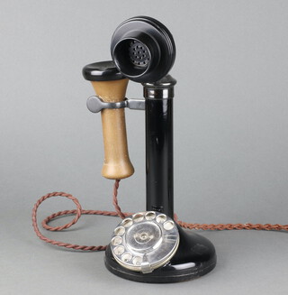 A metal candlestick telephone the base marked F.B.R 59/1