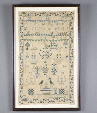 A 19th Century sampler with alphabet, vases of flowers, trees, birds and dogs by Anne Skellorn 1844, contained in a floral border 44cm x 26cm 