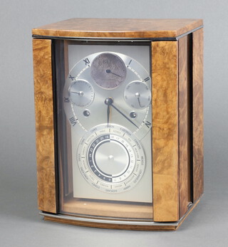 Buben & Zorweg, a "Artemis Classique" 8 day mantel clock, the silvered dial with subsidiary second hand, day hand, calendar hand above a time zone dial, contained in a walnut bow front case 23cm x 17cm x 15cm d, together with original warranty, certificate and key, the clock was purchased in 2008