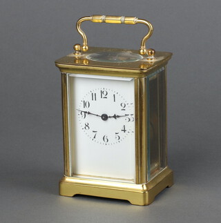 A 20th Century French 8 day carriage timepiece with enamelled dial Arabic numerals, contained in a gilt metal case 11cm x 7cm x 6cm 