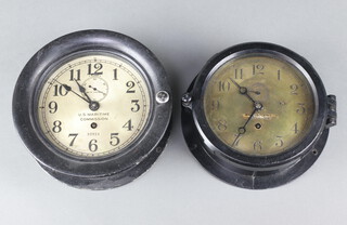 Seth Thomas, an American ward room style clock, the 14cm silvered dial with subsidiary second hand, Arabic numerals marked US Marine Commission 32016 contained in a black Bakelite case (chip to top of case, clock is currently running, no key) together with a Chelsea Clock Company ward room style clock with 13cm gilt dial, Arabic numerals, subsidiary second hand, reverse marked Chelsea Clock Company Boston, contained in a Bakelite case  (chip to top of case, clock currently running, no key) 