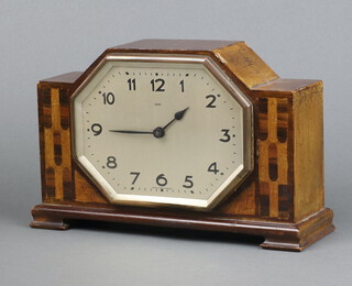 A Wurttemberg Art Deco 8 day timepiece with octagonal silvered dial, Roman numerals, contained in an inlaid walnut case 18cm h x 27cm w x 9cm d 