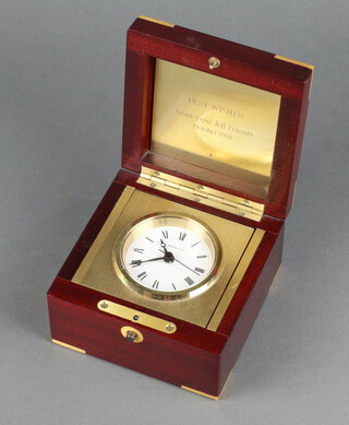 Tiffany and Co, 20th Century travelling clock with paper dial, Roman numerals, contained a gilt and mahogany box with hinged lid, interior marked Best wishes from your KB friends October 1998, 7cm x 11cm x 11cm 