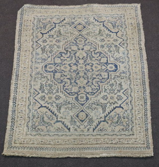 A white and blue ground Afghan rug with central medallion within multi row border 115cm x 92cm 