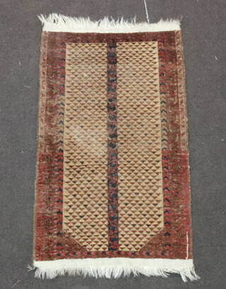 A brown and red ground Belouche rug 114cm x 68cm 