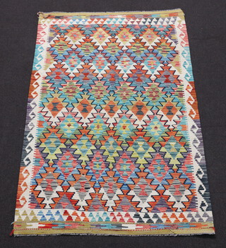 A white, green and yellow ground Chobi Kilim rug 193cm x 125cm 