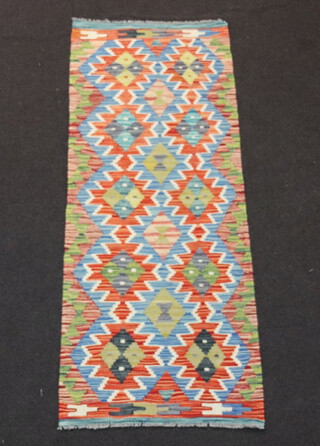 A sand, turquoise and tan ground Chobi Kilim runner with overall geometric designs 160cm x 62cm 