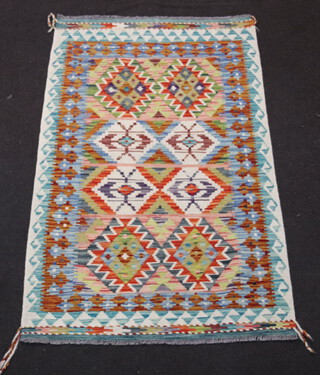 A white, green and sand ground Chobi Kilim rug with diamond designs to the centre 154cm x 98cm 