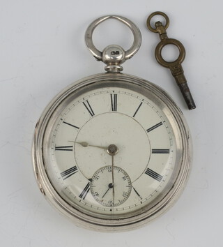 A Victorian silver cased key wind pocket watch  with seconds at 6 o'clock the movement numbered 91673 contained in a 55mm case Chester 1884 with key 