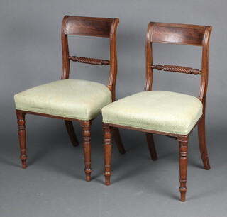 A pair of Georgian mahogany bar back dining chairs with spiral turned mid rails and over stuffed seats, raised on turned supports 83cm h x 50cm w x 42cm d 