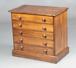 A Victorian rectangular pine collectors chest of 5 drawers with turned handle, raised on a platform base 35cm h x 38cm w x 22cm d 