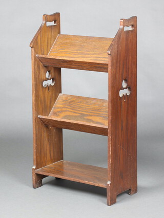 A Liberty style Art Nouveau carved oak 2 tier book trough, the base with undertier 83cm h x 46cm w x 23cm d 