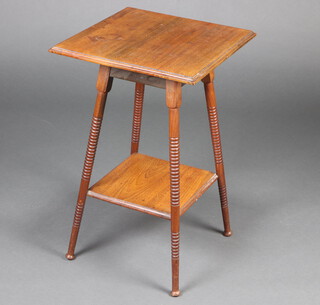 An Edwardian square walnut 2 tier occasional table, raised on ring turned supports 68cm h x 43cm w x 43cm d 