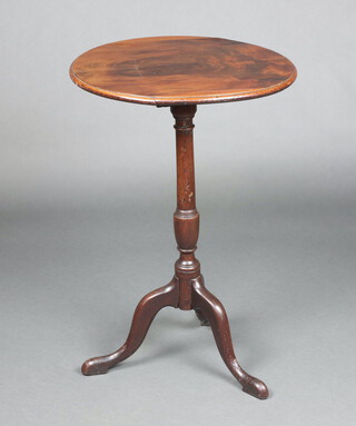 An 19th Century circular mahogany snap top wine table raised on pillar and tripod base 72cm h x 49cm diam. 