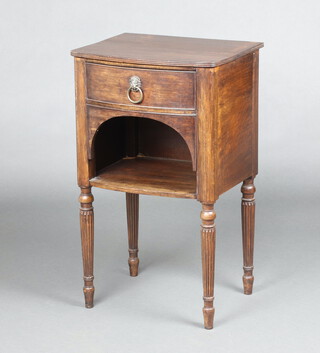 A 19th Century Georgian style bleached mahogany bow front bedside cabinet fitted a drawer above recess, raised on turned and reeded supports 76cm h x 46cm w x 38cm d 